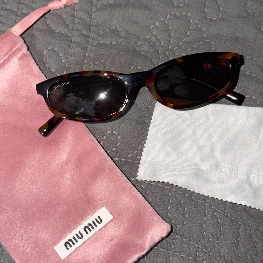 Miu Miu Tortoiseshell Oval Sunglasses in Brown and Black